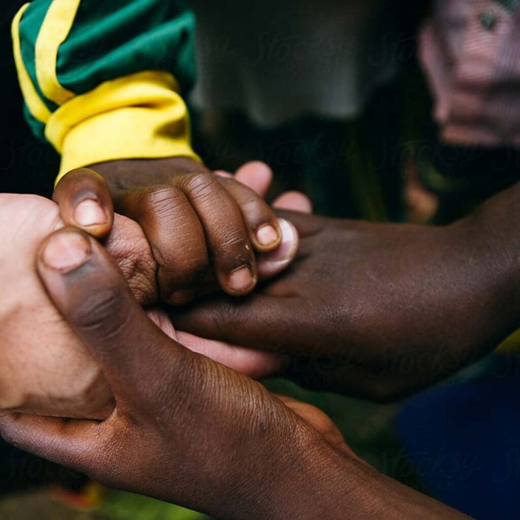 Child holds an adult hand